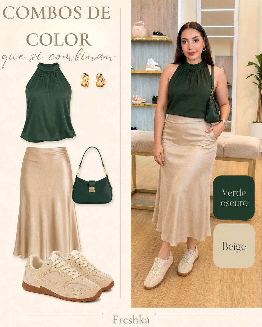 Look con tenis Mónaco Arena: top verde oscuro y falda satinada champán.