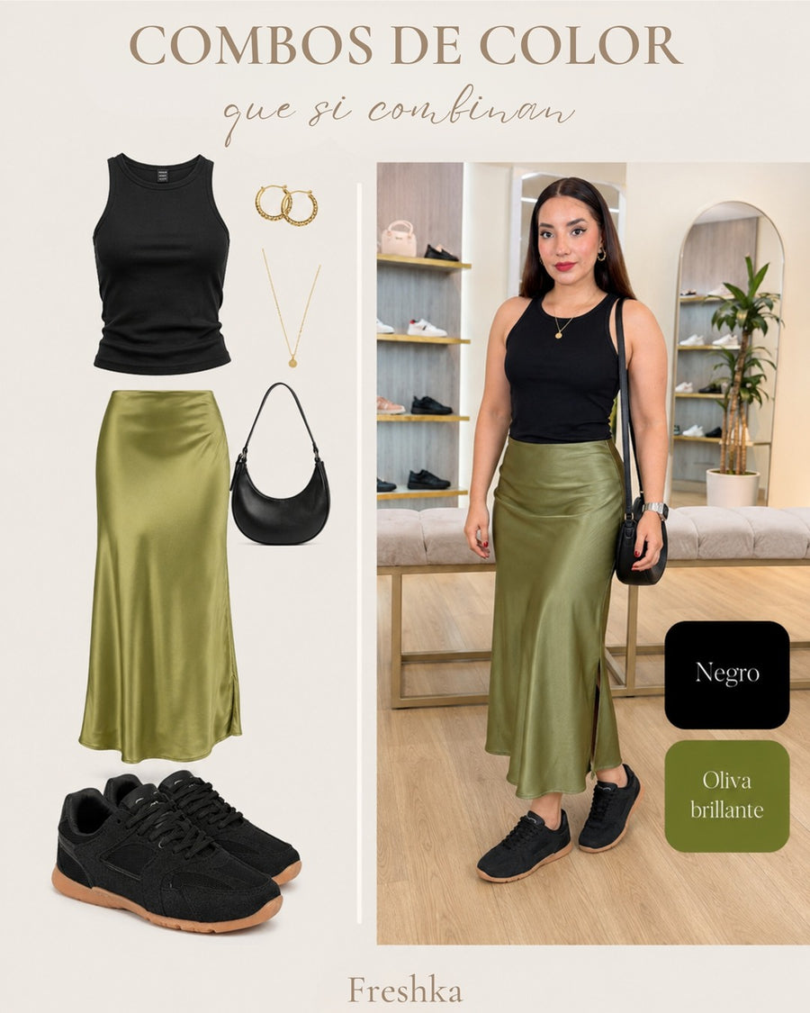 Look con tenis Mónaco Black: top negro y falda satinada verde.