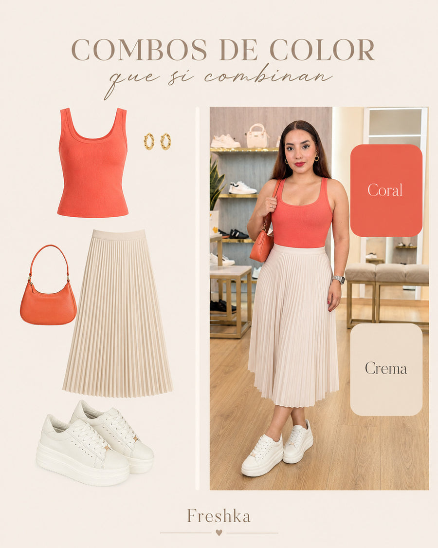 Idea de look con tenis Vainilla: top coral y falda midi plisada crema.